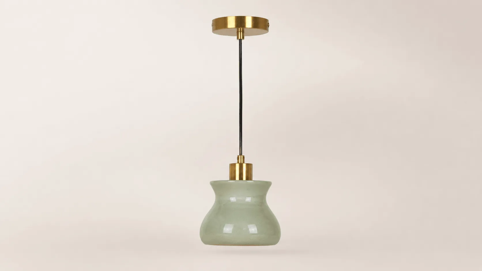 Custom ceramic decor manufacturer example with pale green glazed pendant body, black cord, and brass-tone canopy