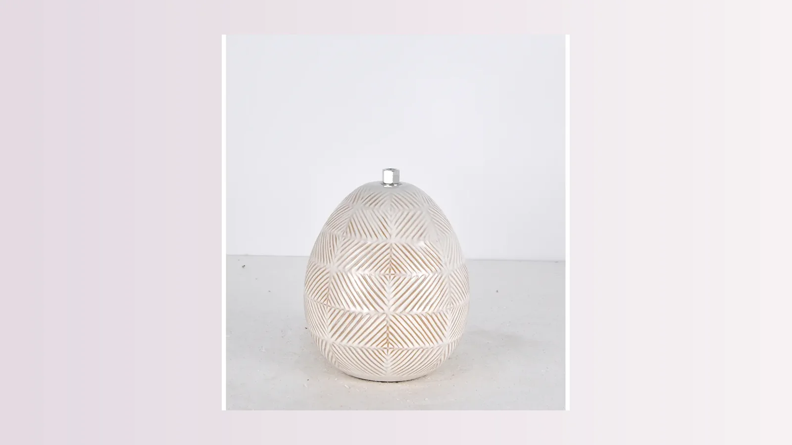 Plum sculptural cordless lamp for a console arrangement